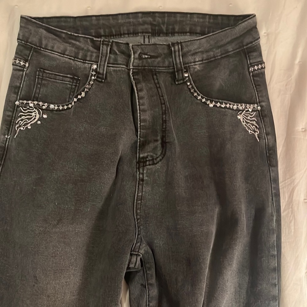 black jeans with designs on back pockets